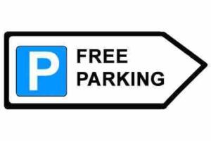 a free parking sign with the words free parking at East Stay 2/3 bedroom Flat in Westoe