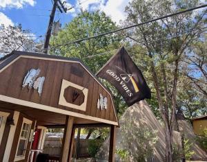 a house with a flag in front of it at Rising Moon - Tipi 8 in Fourth Crossing +17 photos