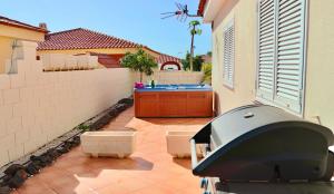 a view of a backyard with a swimming pool at Villa Julia Relax Dream Holiday in Callao Salvaje