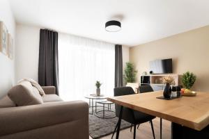 TV a/nebo společenská místnost v ubytování Schicke Apartments in Osnabrück I private Parkplätze I home2share