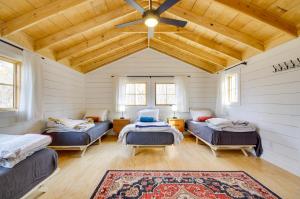 a room with three beds and a ceiling at Cozy Steelville Retreat River and Trail Access! in Steelville