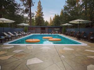 a swimming pool with pizzas in the middle of it at 2412 - Oak Knoll Studio with Jacuzzi #15 cabin in Big Bear Lake