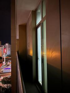 a window of a building with a view of a city at Soli centr apartman in Mezitli