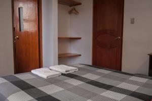 Postel nebo postele na pokoji v ubytování Real House Cusco