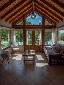 a living room with a couch and a table at La Huala in San Carlos de Bariloche