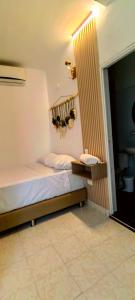 מיטה או מיטות בחדר ב-HOTEL BOHO BOUTIQUE