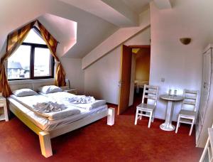 Postel nebo postele na pokoji v ubytování Guest House ANEX
