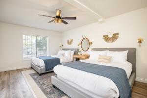 a bedroom with two beds and a ceiling fan at The Riesling Retreat by AvantStay Estate w Pool, HotTub, Putting Green & Pickle Ball Court in Sage