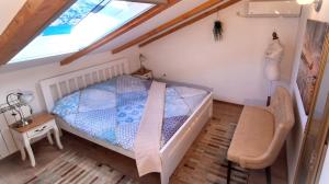 a bedroom with a bed and a window at Apartments Peranovic 2 in Kotor