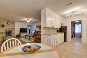 a kitchen and living room with a table and chairs at Beaumont Rental Home about 2 Mi to Gulf Terrace Park! in Beaumont