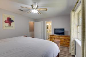 a bedroom with a bed and a ceiling fan at Beaumont Rental Home about 2 Mi to Gulf Terrace Park! in Beaumont