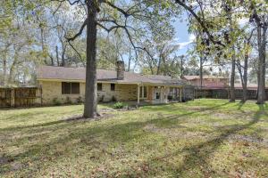 an old house with a yard and a fence at Beaumont Rental Home about 2 Mi to Gulf Terrace Park! in Beaumont
