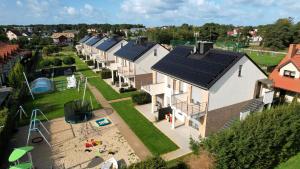 an aerial view of a row of houses with a playground at SIEDEM WYDM in Rowy