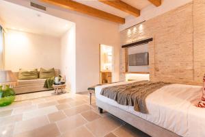 En eller flere senge i et værelse på Borgo Vinceri