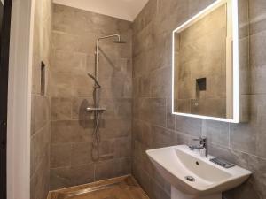 a bathroom with a sink and a shower at Skylark in Huggate