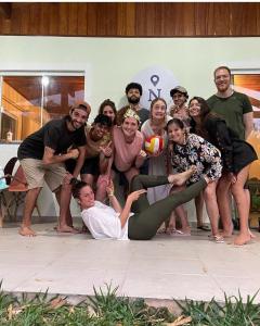 a group of people posing for a picture at Nômades Adventure Hostel & Coworking in Florianópolis