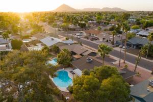 an aerial view of a suburb with a swimming pool at West Ridge by AvantStay A Place Of Comfort Perfect Sunsets by the Pool ❤ in Scottsdale