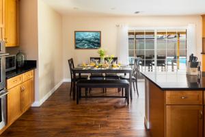 a kitchen and dining room with a table and chairs at West Ridge by AvantStay A Place Of Comfort Perfect Sunsets by the Pool ❤ in Scottsdale
