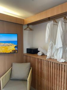 TV a/nebo společenská místnost v ubytování Santa Aldeia Hotel