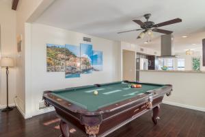 a pool table in a room with a ceiling fan at Sonoran Sunshine by AvantStay Pool Putting Green BBQ Ping Pong Pool Table Entertainers Wonderland in Scottsdale