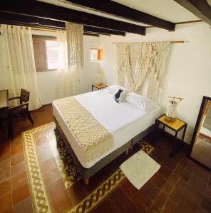 Postel nebo postele na pokoji v ubytování Hostal Patio del Río
