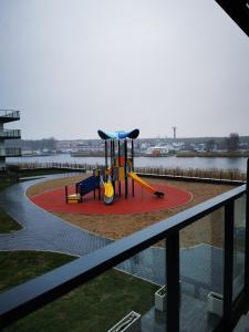 a view of a playground in a building at Apolonia apartamenty I - SPA in Dziwnów