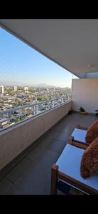 a balcony with a view of a city at Depto Carvajal in Santiago