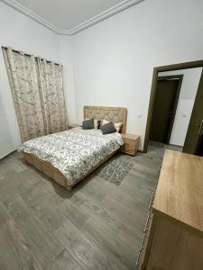 Postelja oz. postelje v sobi nastanitve MyZo Superbe Appartement familial bien situé à Marrakech