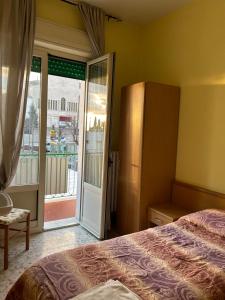 Postel nebo postele na pokoji v ubytování Albergo pensione Bianco