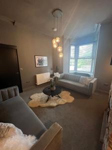 a living room with a couch and a table at Lancaster Place 18 in Carnforth
