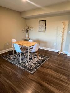 a dining room with a table and chairs at Spacious 2 Bed, 2 Bath Uptown Gem in the Heart of the City-Parking-Wi-Fi-Balcony-Walk to BOA Stadium in Charlotte +16 photos