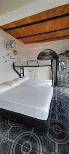 a bedroom with a bed in a room at finca casita el mirador in Medellín