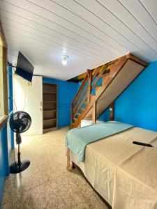 Cama ou camas em um quarto em Pousada & Camping Tubarão