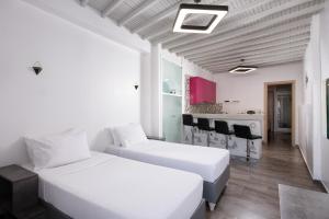 Ένα ή περισσότερα κρεβάτια σε δωμάτιο στο Mykonos Town Apartment by Sunshine Place World