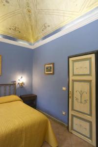 Кровать или кровати в номере La Casa di Mamma