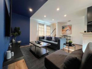 a living room with a couch and a table at Trendy 2BR Near Hollywood Hotspots - BR9 in Los Angeles