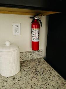 a red fire hydrant on the corner of a kitchen counter at New House family friendly near Six Flags Sea World in Helotes