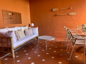 a living room with a couch and a table at Don Carlos Marbella Beach in Marbella