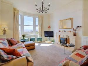 a living room with two couches and a fireplace at 5 Bed in Morecambe 87639 in Heysham