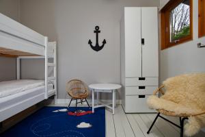 Postel nebo postele na pokoji v ubytování Captain's Lounge - Bungalow XL
