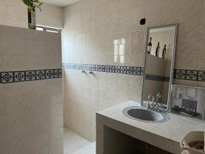 a bathroom with a sink and a mirror at Casa Diaz calle 5 de mayo in Parras de la Fuente