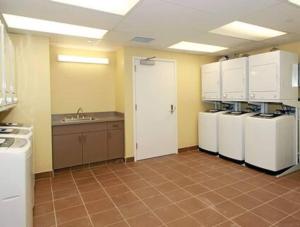 a kitchen with white refrigerators and a sink at Brooks Beach Vacations 4 star Wyndham Resort 2003 Waikiki in Honolulu