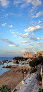 a group of people on a beach near the ocean at Panoramic Sea View in Chania Town