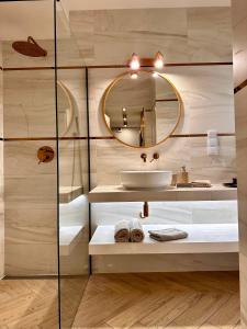 a bathroom with a sink and a mirror at Apartamenty Kielce- APARTAMENT RUBIN przy zalew kielecki, faktura, parking, centrum in Kielce +83 photos