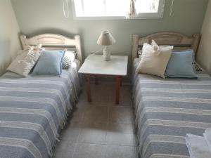Tempat tidur dalam kamar di Las Lavandas ´´Casa de Playa´´