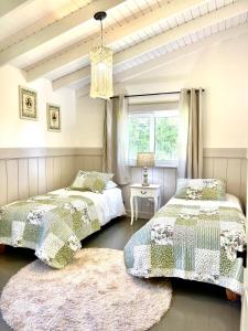 En eller flere senge i et værelse på Cabaña Vintage