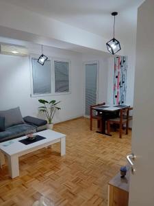 a living room with a couch and a table at Apartments Stela Rosa Ohrid in Ohrid