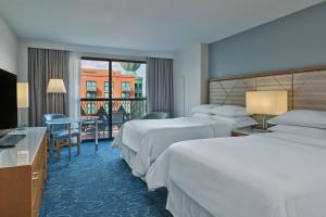 Cama ou camas em um quarto em Walt Disney World Dolphin