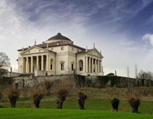 a large white house on top of a hill at Casa Pallamaio Historic Center Vicenza in Vicenza