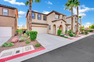 a house with palm trees and a driveway at Todor Las Vegas Home Away From Home in Las Vegas